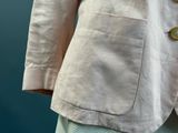 a close up of a jacket with buttons on it