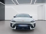 the front view of a silver sports car in a white room