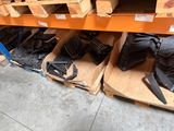 many pairs of shoes that are sitting on the shelves