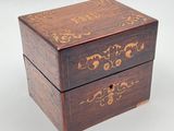 an image of a small wooden box with a floral design