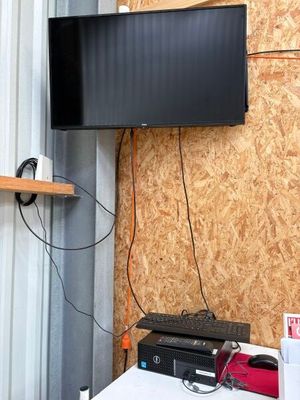 a flat screen tv mounted on a wall in a room