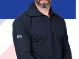 a man that is standing in front of a blue and white background