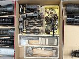 a box full of different types of toy trains in it