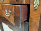 a close up of a wooden desk with a drawer on it