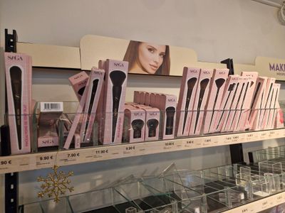 a lot of makeup brushes on the shelves in the store