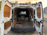 a van that is parked in the street with its door open
