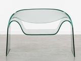 an image of a glass coffee table with a curved glass top