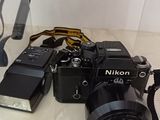 a camera that is sitting on a table next to a camera