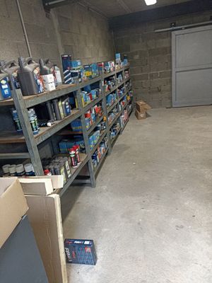 a room with a lot of shelves and boxes on the floor