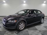 a picture of a black volvo suv parked in a garage