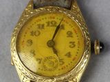 an image of a close up of a wrist watch on a table