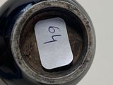 a small piece of paper on the top of a wine bottle