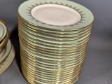 a stack of plates sitting next to each other on a table