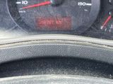 a close up of a car dashboard with a speedometer