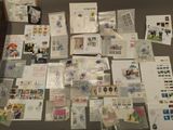 a lot of stamps and postcards on the table