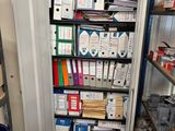 a small storage area with many boxes and files