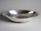 an image of a silver bowl on a white surface