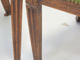 a green upholstered bench with a wooden frame