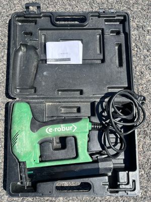 an image of a green cordless nail drill in a black case