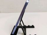 a cell phone that is sitting on a stand