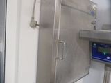 an image of a kitchen with a digital scale on the wall