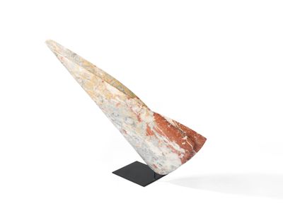 a sculpture of a triangular shaped object on a black stand