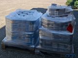 many stacks of plastic containers sitting on a pallet