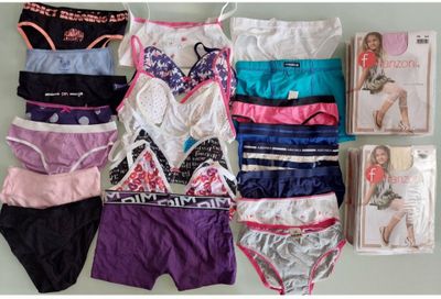 a lot of underwear that are laying out on a table