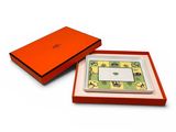 an orange gift box with a note inside and a note in it