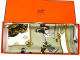 an orange box containing a pair of men ' s socks and a tie