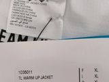 a label on the back of a white shirt