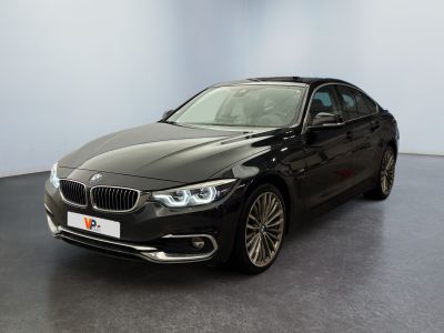 the bmw 6 series saloone is parked in a showroom