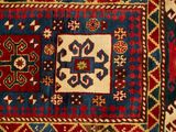 an image of a red, blue, and green rug with a design on it