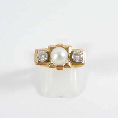 an image of a pearl and diamond ring on a white surface