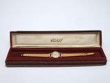 an image of a watch in a wooden box with a white background