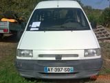 a white van that is parked in the grass