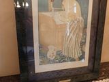 a framed picture of a woman washing her hands in a sink
