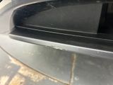 a close up of a car door handle with a small hole in it