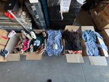 many boxes of clothes and shoes on the floor