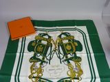 green and white scarf with a pair of shoes on it