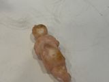 a small piece of food on a plate on the table