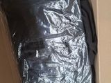 a cardboard box with a bag of clothing inside of it
