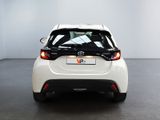 the rear end of a white toyota c - hr parked in a room