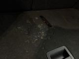 a remote control in the middle of the floor of a car