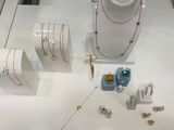 a display of jewelry on display in a glass case