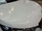 a white car that is parked in a garage