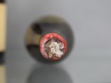 a close up of a bottle of wine on a table