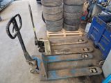 a pallet with a stack of tires on it in a warehouse