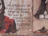 graffiti on the wall of a building with a picture of a clown on it