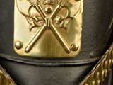 a close up of a helmet with a chain around it
